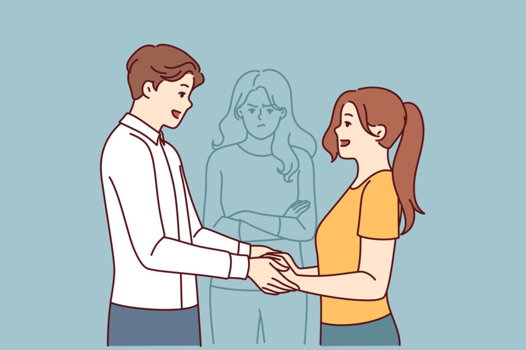 a happy couple holding hands while an outline of an angry woman is watching them - a concept of cheating.