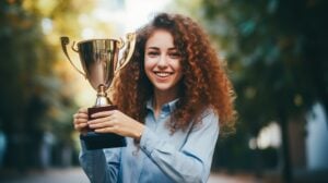 Cheerful student showcasing a won trophy