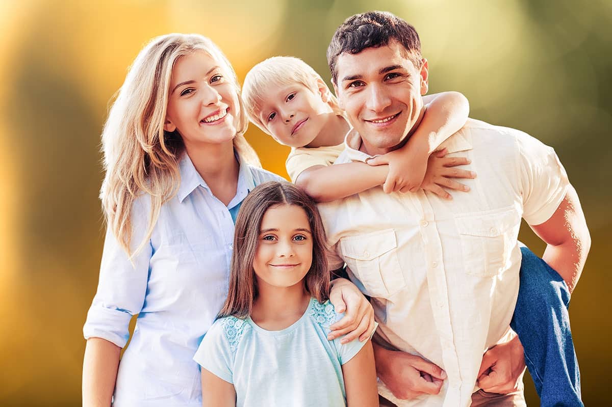 Beautiful smiling lovely family on outdoor background