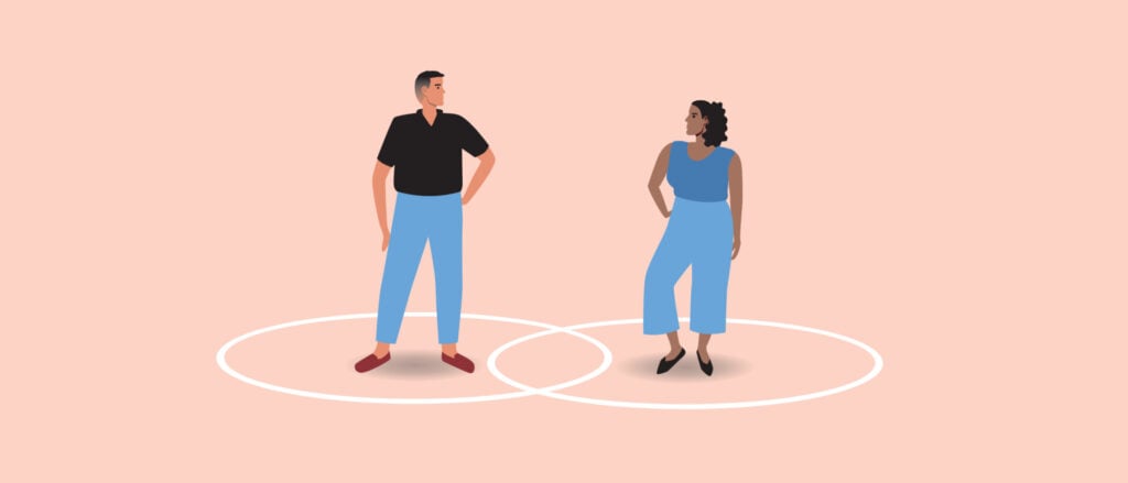 A man and a woman stood within two separate circles where they both overlap slightly at the middle